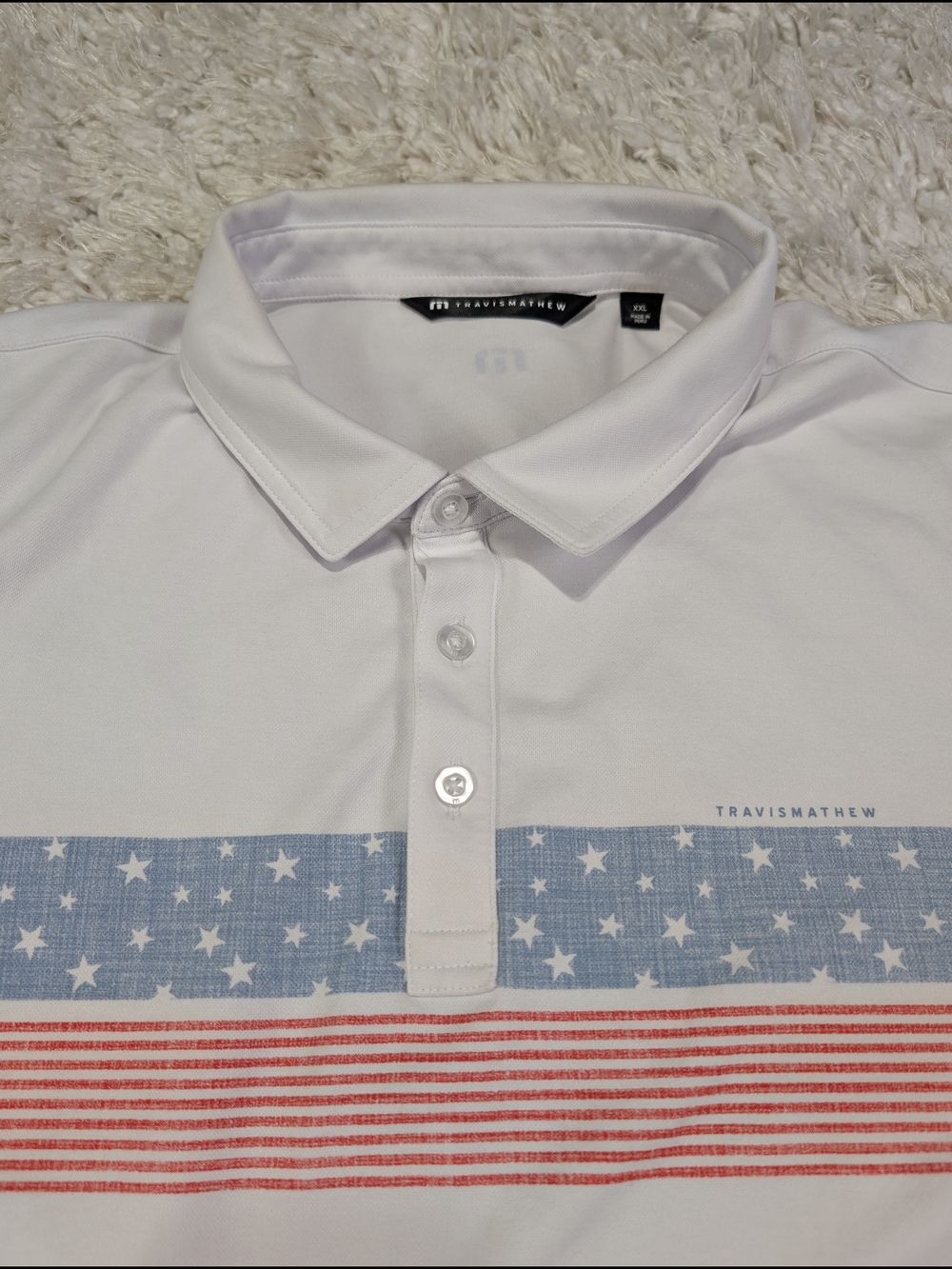 Travis Mathew White Polo with Red White And Blue Flag Stripe